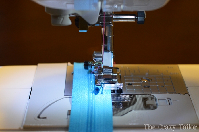 Regular presser foot on zipper showing needle positioned too far from zipper teeth