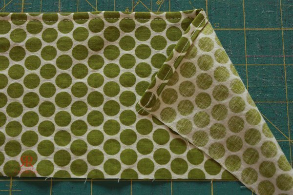 Hem the woven pocket strip