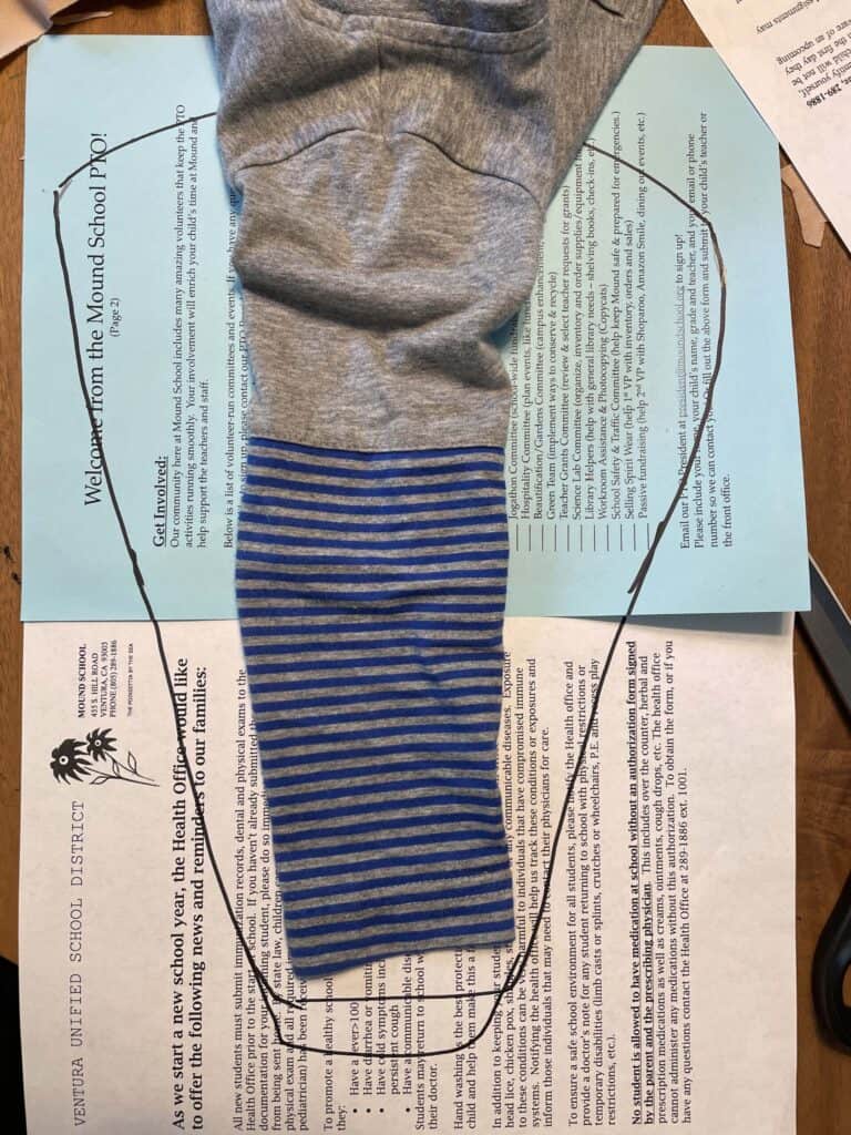 #1 DIY Muscle Man Costume | Circus Performer 5 Shirt sleeve laid on top of paper to create a sleeve pattern piece
