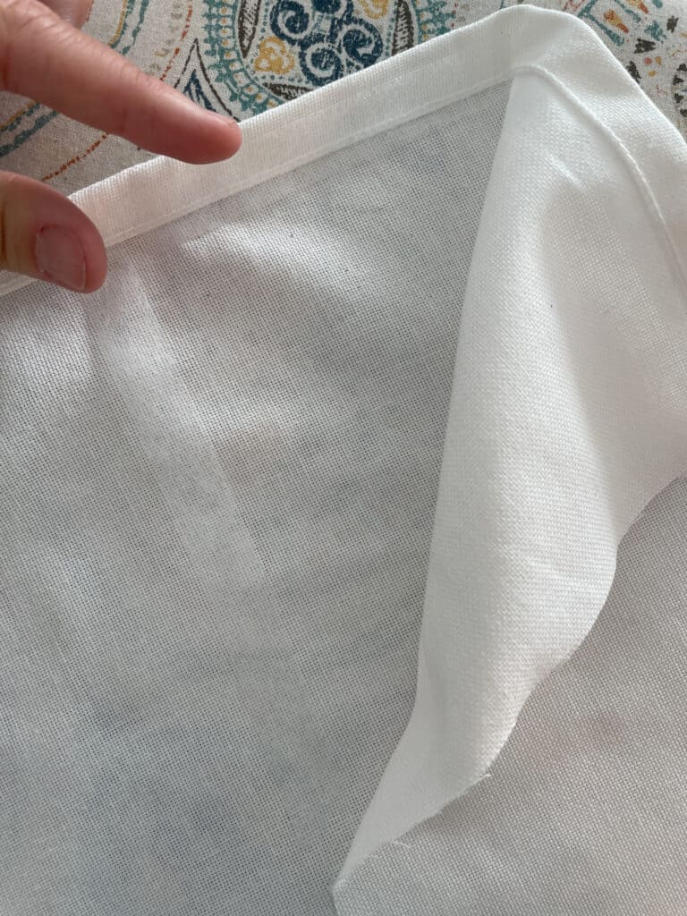 Newly hemmed curtain panel using hem tape